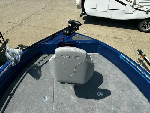 Slide: The Image of 2024 Nitro ZV19 Sport boat with gray seat and trolling motor. - 9