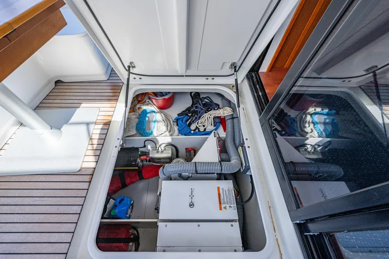Slide: The Image of 2018 Beneteau Swift Trawler 44 aft deck with stairs and ocean view. - 18