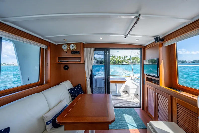 Slide: The Image of Engine room of a 2018 Beneteau Swift Trawler 44 with visible machinery and equipment. - 21