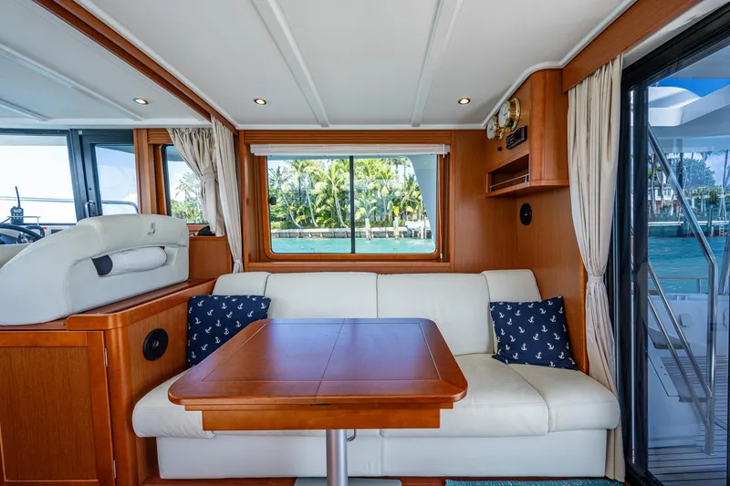 Slide: The Image of Interior of 2018 Beneteau Swift Trawler 44 with ocean view and modern furnishings. - 22
