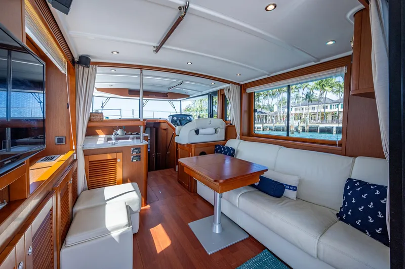 Slide: The Image of 2018 Beneteau Swift Trawler 44 kitchen with wood cabinetry and modern appliances. - 27