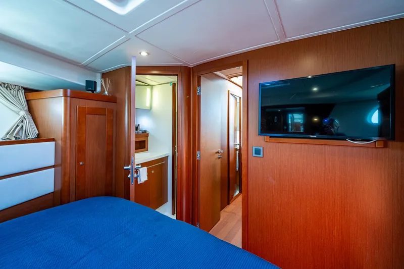 Slide: The Image of Luxurious master cabin in 2018 Beneteau Swift Trawler 44 with skylight and portholes. - 30