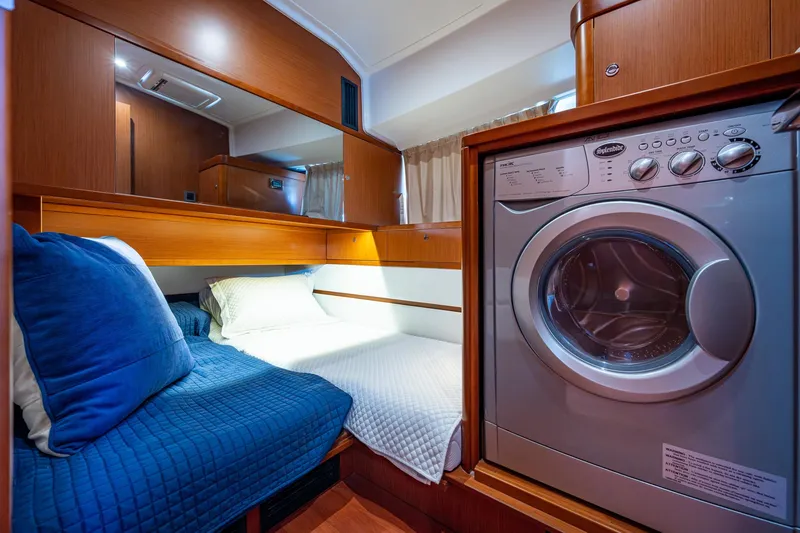 Slide: The Image of 2018 Beneteau Swift Trawler 44 bathroom with modern fixtures and wooden cabinetry. - 32