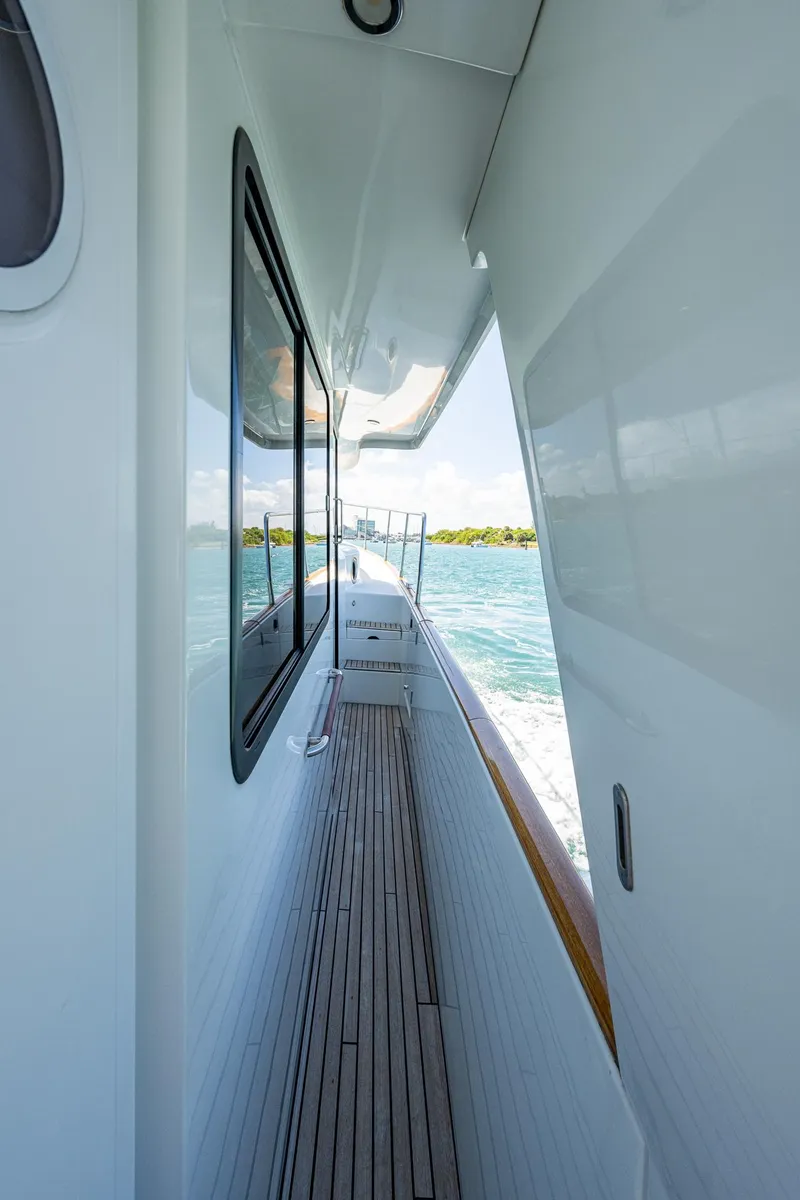 Slide: The Image of 2018 Beneteau Swift Trawler 44 cruising on clear blue waters under a sunny sky. - 7
