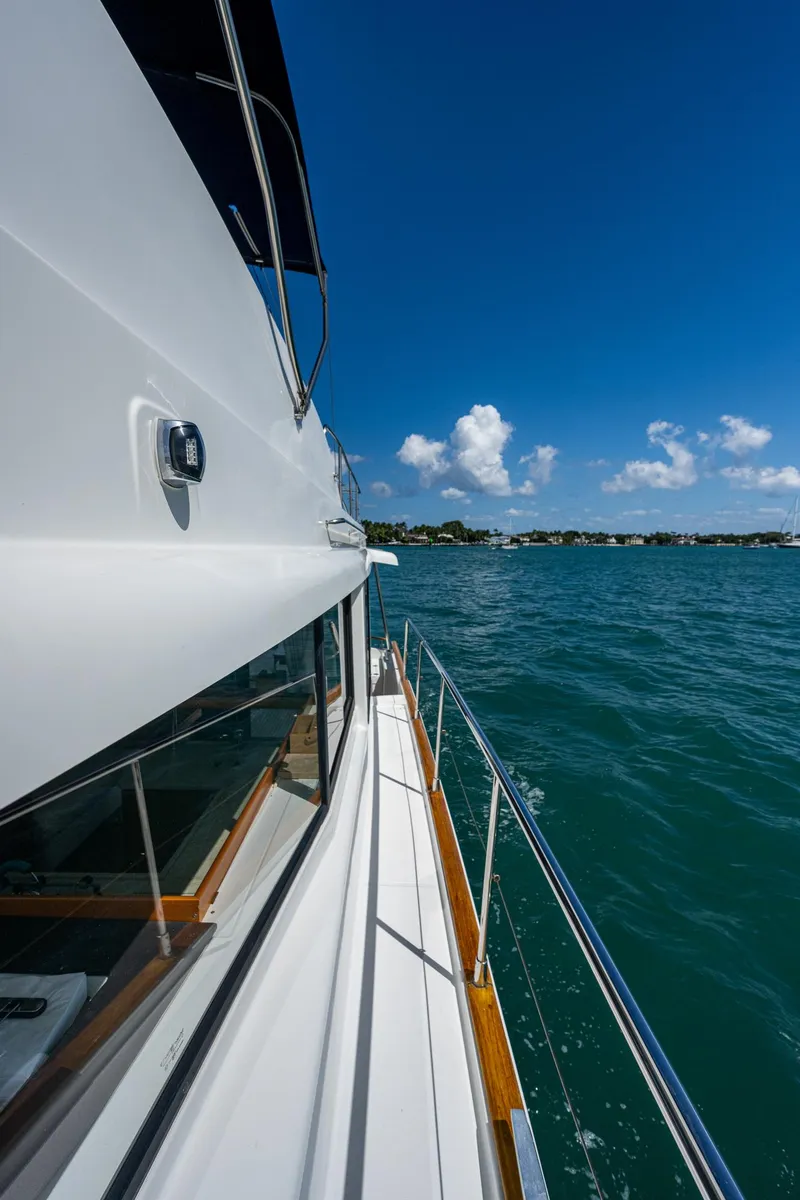 Slide: The Image of 2018 Beneteau Swift Trawler 44 side deck with ocean view. - 8