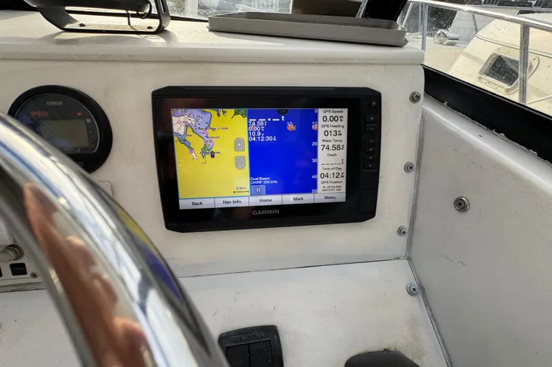 Slide: The Image of Garmin GPS display on 1981 Mako 233 Walk Around boat dashboard. - 5