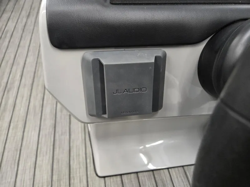 Slide: The Image of JL Audio speaker on 2024 Harris Cruiser 210 boat dashboard. - 14