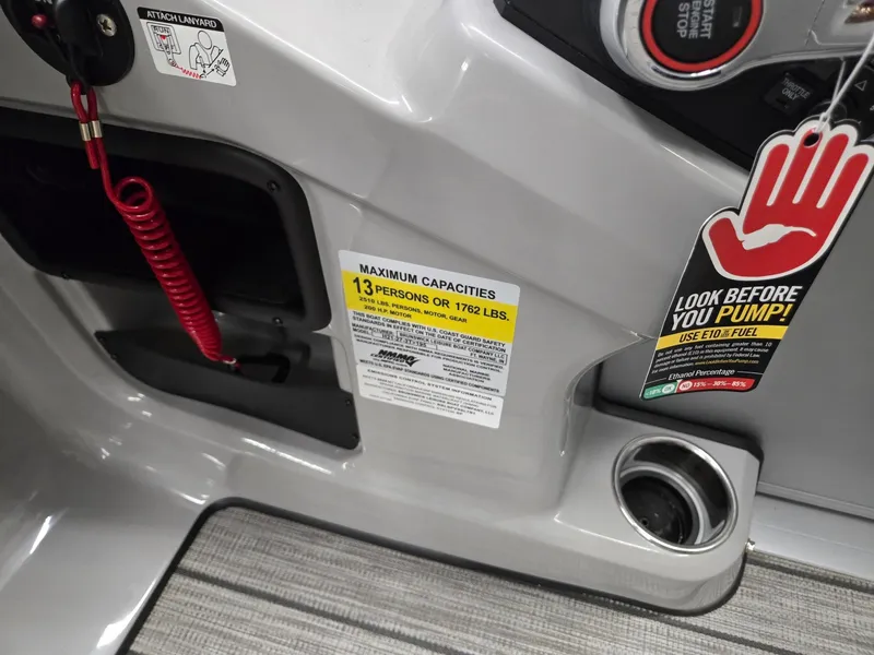 Slide: The Image of Harris Cruiser 210 2024 boat interior with capacity label and safety warning. - 16