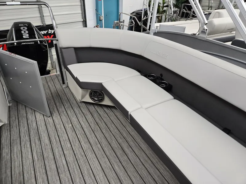 Slide: The Image of 2024 Harris Cruiser 210 boat interior with gray seating and flooring. - 18