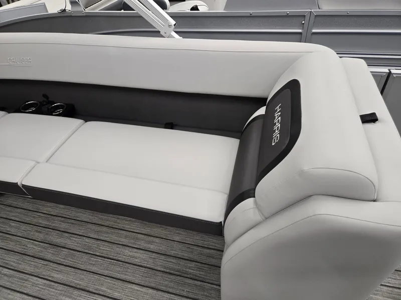 Slide: The Image of 2024 Harris Cruiser 210 boat interior with gray seating and cup holders. - 19
