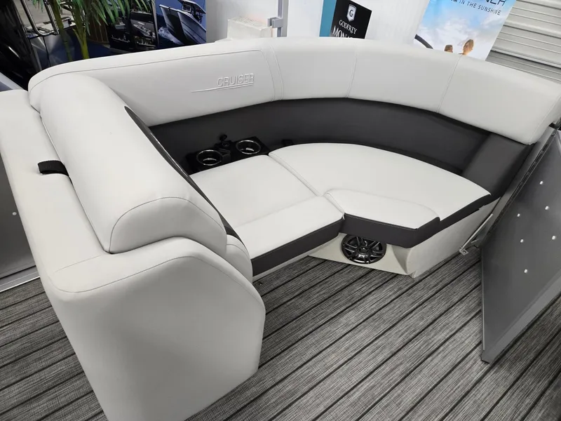 Slide: The Image of 2024 Harris Cruiser 210 boat interior with plush seating and cup holders. - 20