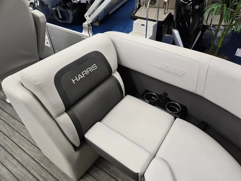 Slide: The Image of 2024 Harris Cruiser 210 boat interior with comfortable seating and cup holders. - 24