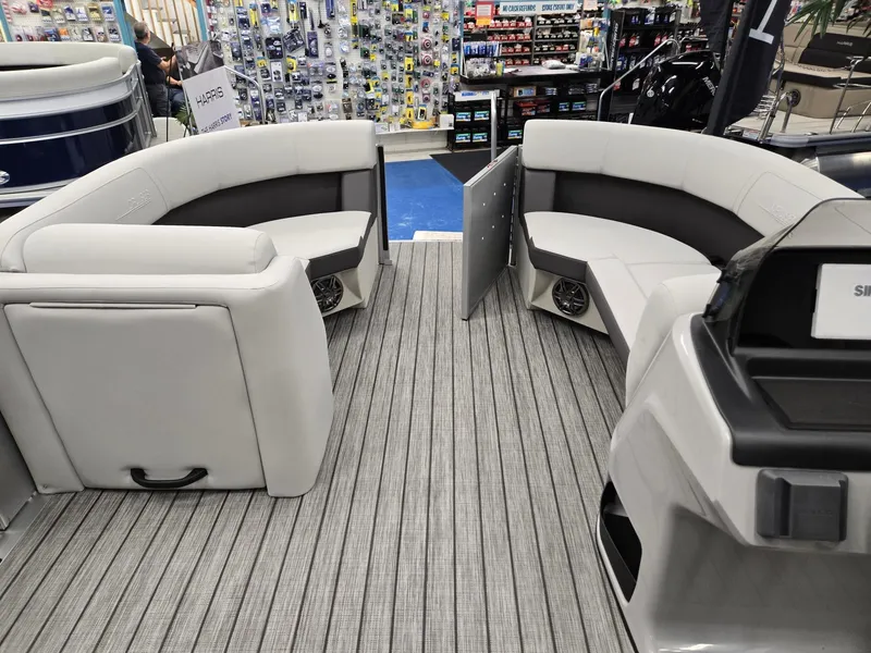 Slide: The Image of 2024 Harris Cruiser 210 interior with gray seating and flooring. - 25