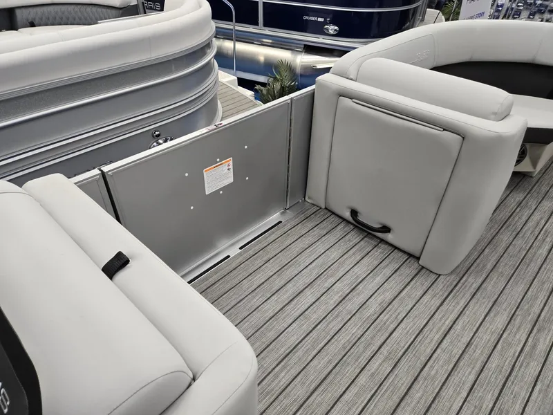 Slide: The Image of 2024 Harris Cruiser 210 boat interior with gray seating and flooring. - 26