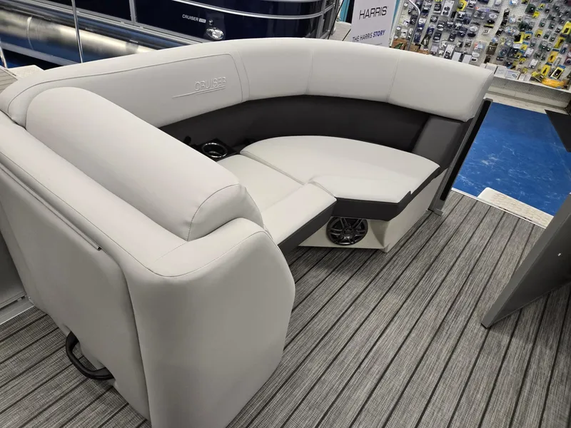 Slide: The Image of 2024 Harris Cruiser 210 boat interior with gray seating and striped flooring. - 30