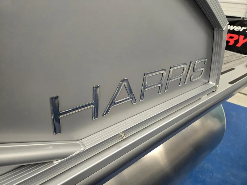 Slide: The Image of 2024 Harris Cruiser 210 boat close-up with logo. - 33