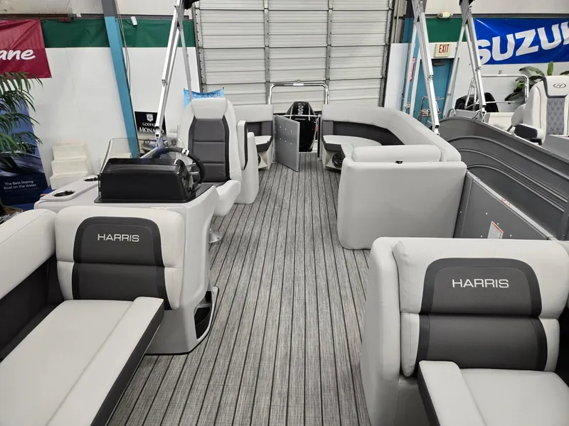 Slide: The Image of 2024 Harris Cruiser 210 pontoon boat interior with gray seating and flooring. - 6