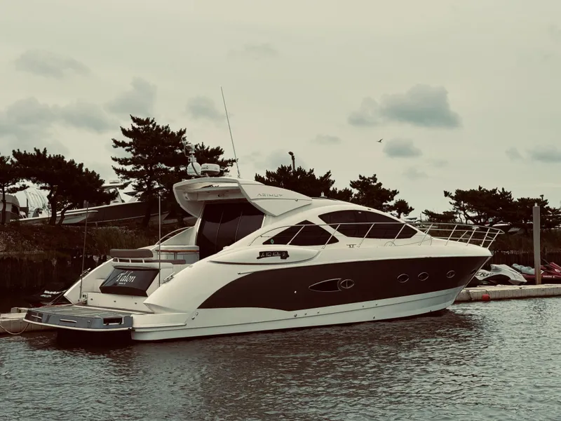 Slide: The Image of 2009 Azimut Atlantis 50 yacht docked in a marina. - 1