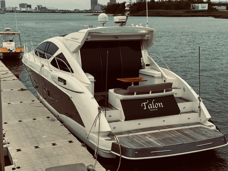 Slide: The Image of 2009 Azimut Atlantis 50 yacht docked at a marina. - 2
