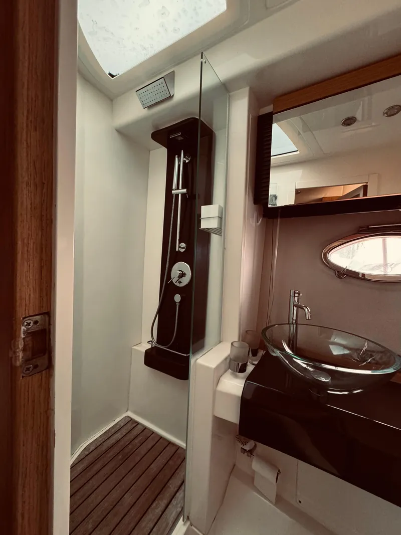 Slide: The Image of 2009 Azimut Atlantis 50 yacht bathroom with modern shower and sink. - 21