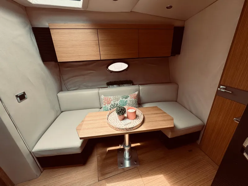 Slide: The Image of Interior of 2009 Azimut Atlantis 50 yacht with cozy seating and wooden table. - 25