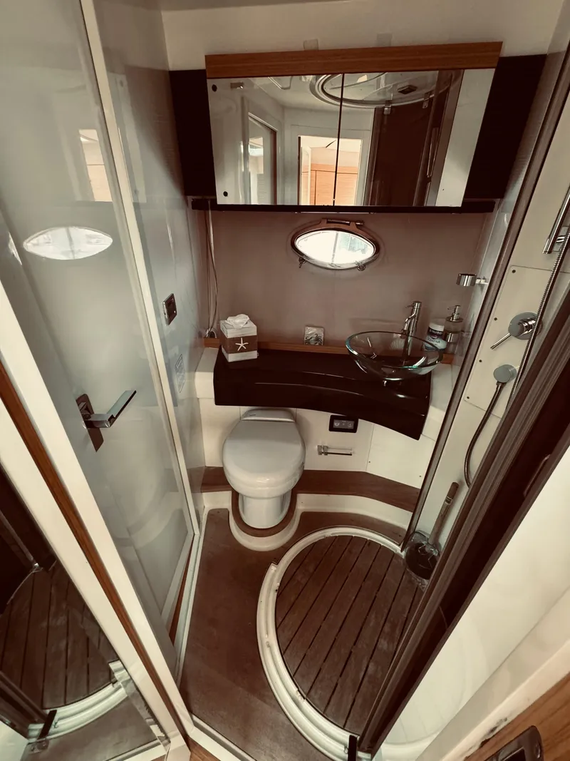 Slide: The Image of Luxurious bathroom in a 2009 Azimut Atlantis 50 yacht with modern fixtures. - 27