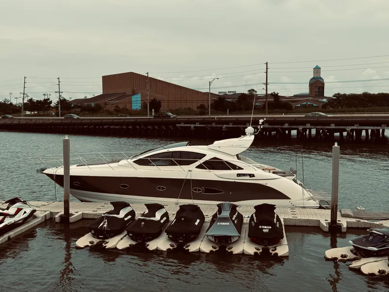 Slide: The Image of 2009 Azimut Atlantis 50 yacht docked with jet skis in foreground. - 28