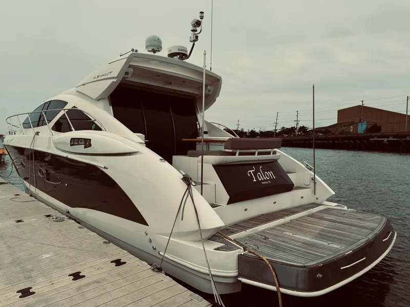 Slide: The Image of 2009 Azimut Atlantis 50 yacht docked at a marina. - 3