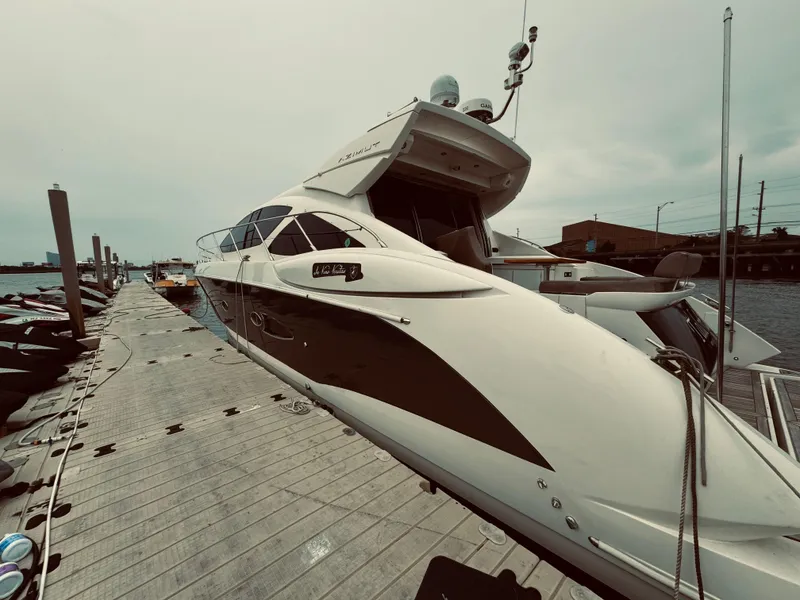 Slide: The Image of 2009 Azimut Atlantis 50 yacht docked at a marina. - 4