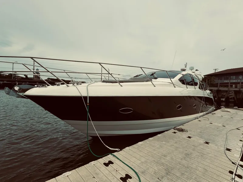 Slide: The Image of 2009 Azimut Atlantis 50 yacht docked at a marina. - 6