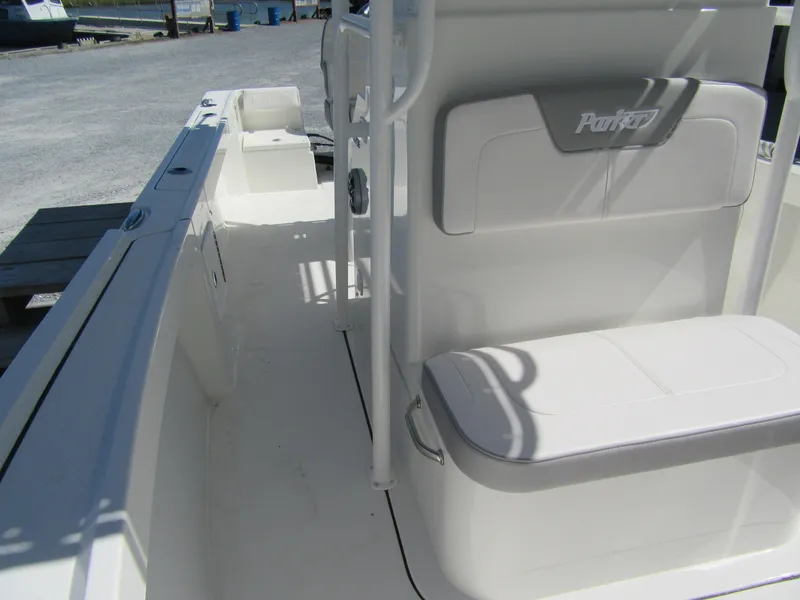 Slide: The Image of 2025 Parker 21 Special Edition boat interior, featuring seating and storage. - 11