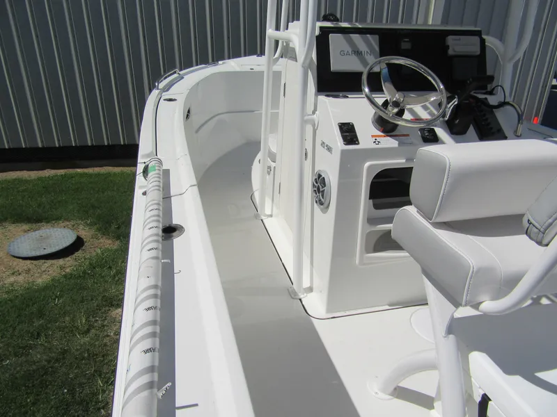 Slide: The Image of 2025 Parker 21 Special Edition boat interior with steering console and seating. - 12