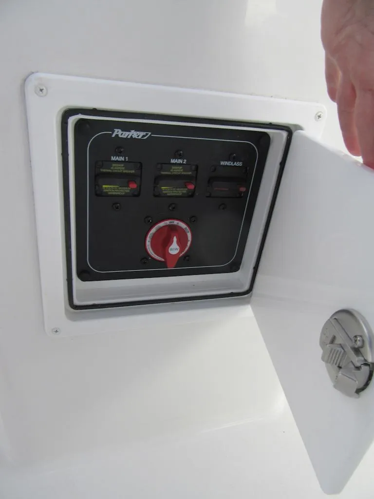 Slide: The Image of Control panel on a 2025 Parker 23 SE CC boat, featuring switches and a red dial. - 11