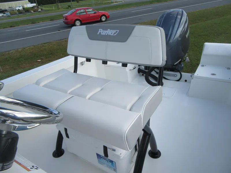 Slide: The Image of 2025 Parker 23 SE CC boat interior with seating and outboard motor. - 12