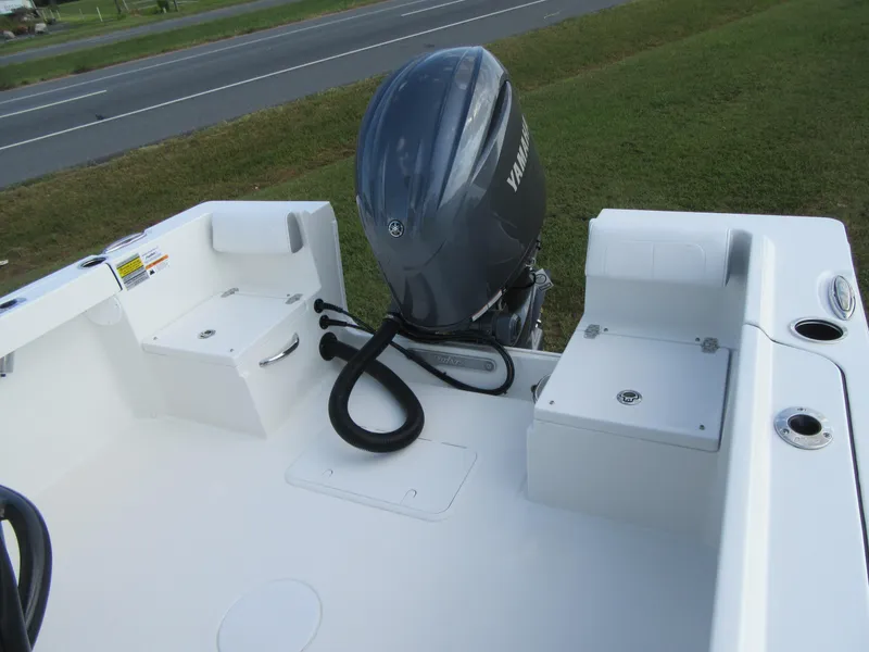 Slide: The Image of 2025 Parker 23 SE CC boat with Yamaha outboard motor, viewed from the deck. - 16