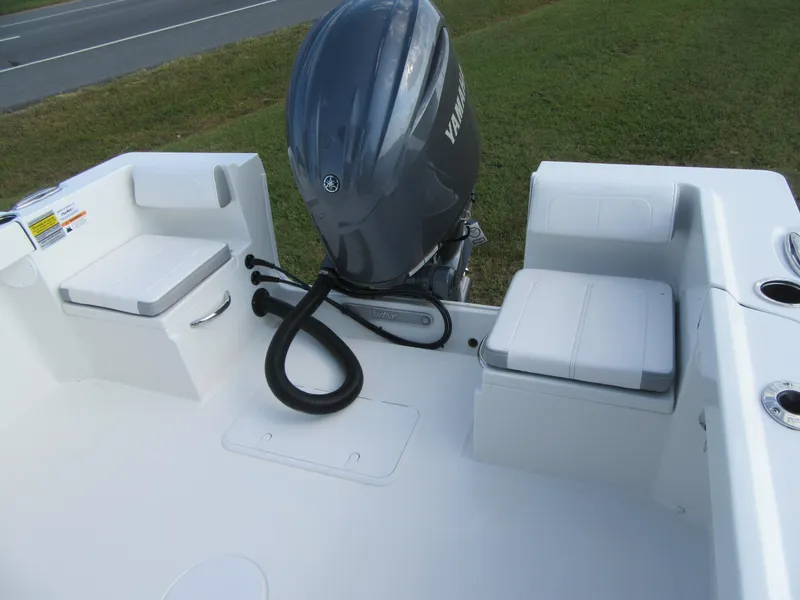 Slide: The Image of 2025 Parker 23 SE CC boat with Yamaha outboard motor, featuring cushioned seating and clean deck design. - 22