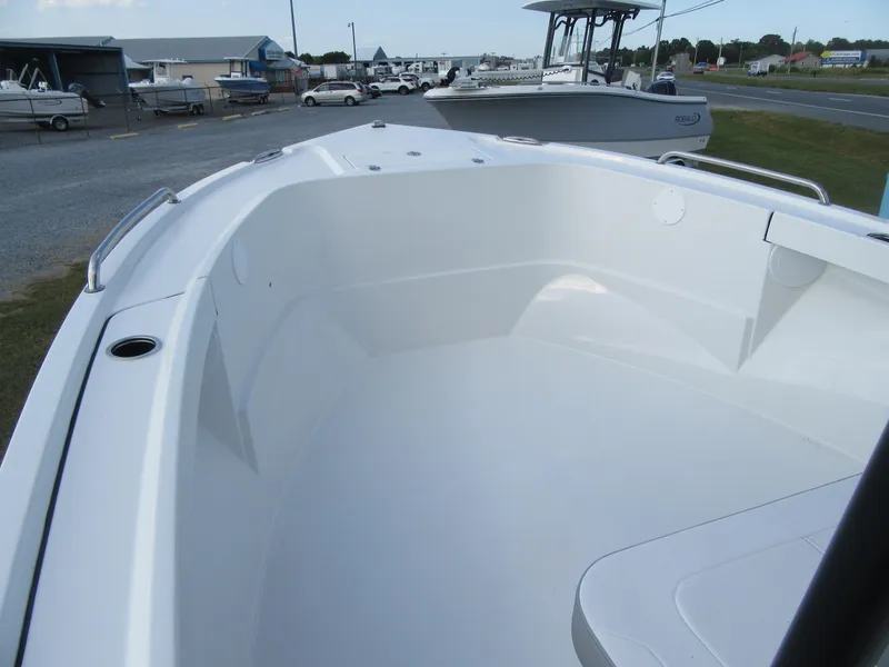 Slide: The Image of 2025 Parker 23 SE CC boat interior, showcasing spacious deck and sleek design. - 6