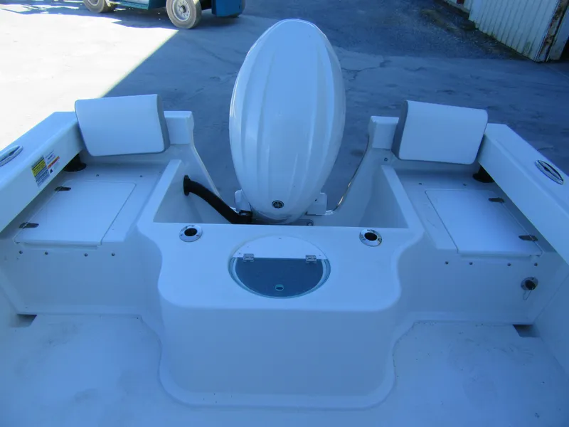 Slide: The Image of 2025 Parker 2120 Sport Cabin boat interior with engine and storage compartments. - 11