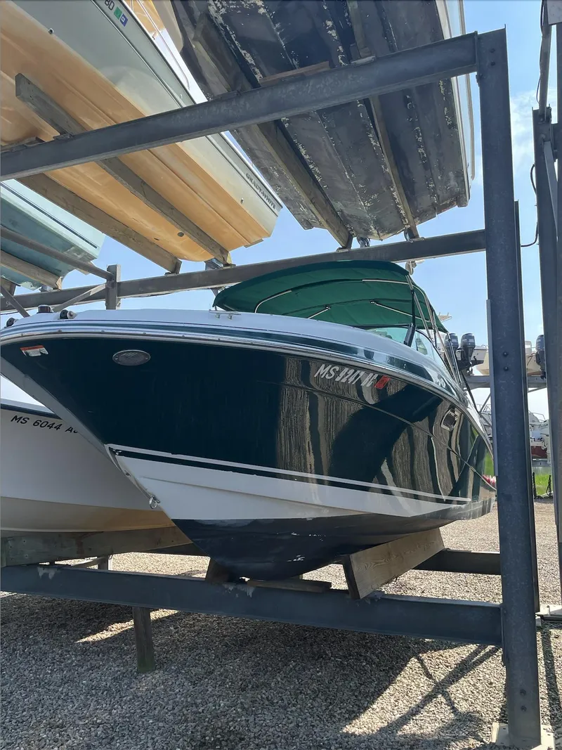 Slide: The Image of 2004 Four Winns 250 Horizon boat in dry storage. - 2