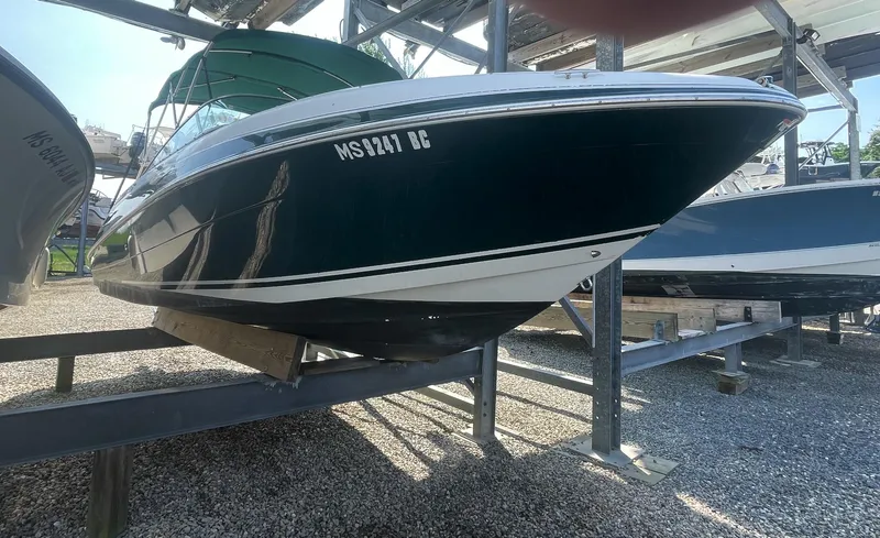 Slide: The Image of 2004 Four Winns 250 Horizon boat on a storage rack. - 3