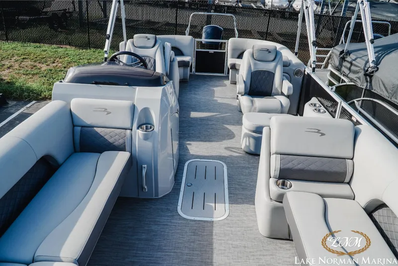 Slide: The Image of 2023 Bennington 23 LSR pontoon boat interior with luxurious seating and modern design. - 14