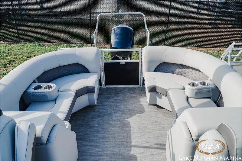 Slide: The Image of 2023 Bennington 23 LSR pontoon boat interior with plush seating and cup holders. - 16