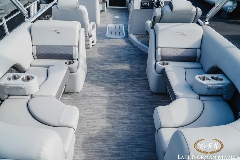 Slide: The Image of 2023 Bennington 23 LSR boat interior with luxurious seating and cup holders. - 7