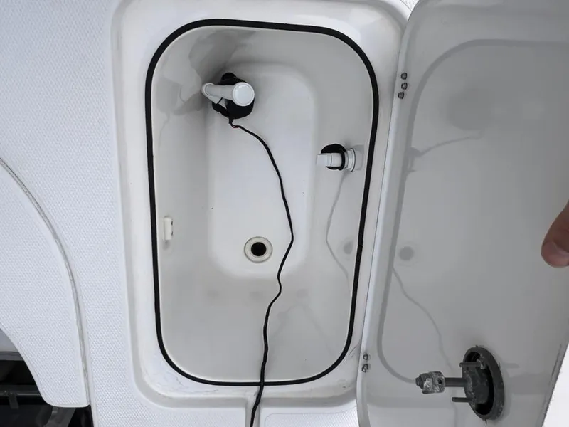 Slide: The Image of Open storage compartment of a 2001 Rinalli 2100 Bay boat. - 15