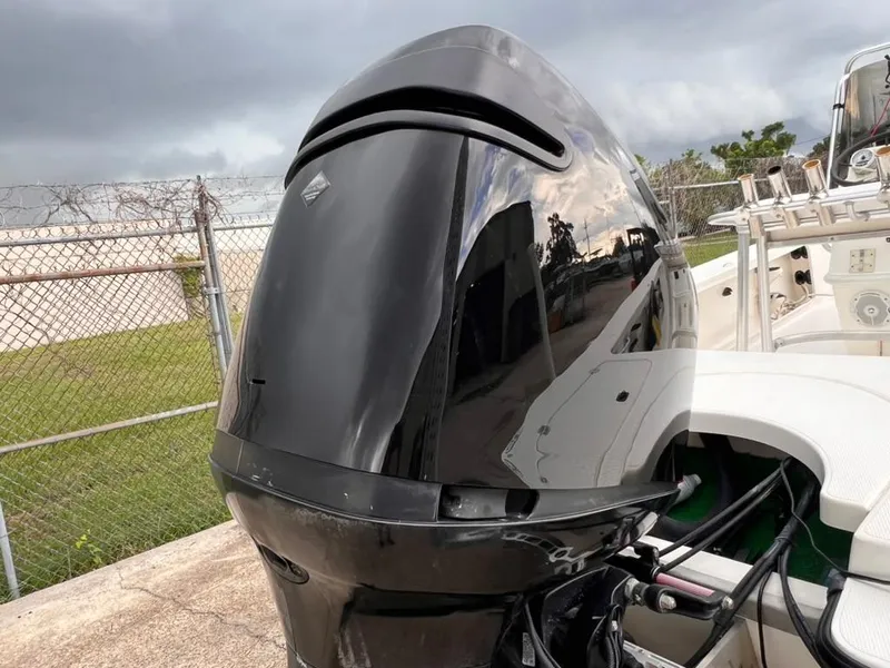 Slide: The Image of 2001 Rinalli 2100 Bay boat with a black outboard motor. - 17