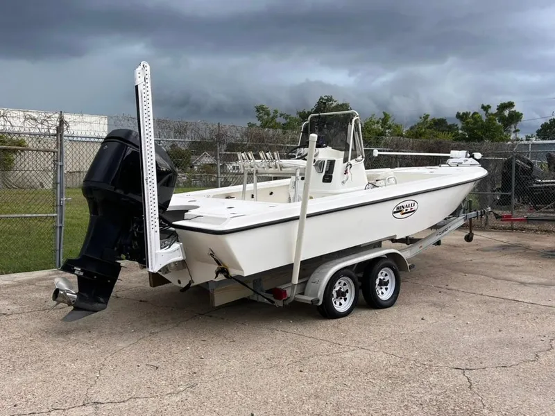 Slide: The Image of 2001 Rinalli 2100 Bay boat on a trailer with an outboard motor. - 3