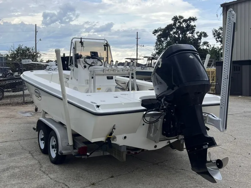 Slide: The Image of 2001 Rinalli 2100 Bay boat on a trailer with an outboard motor. - 5