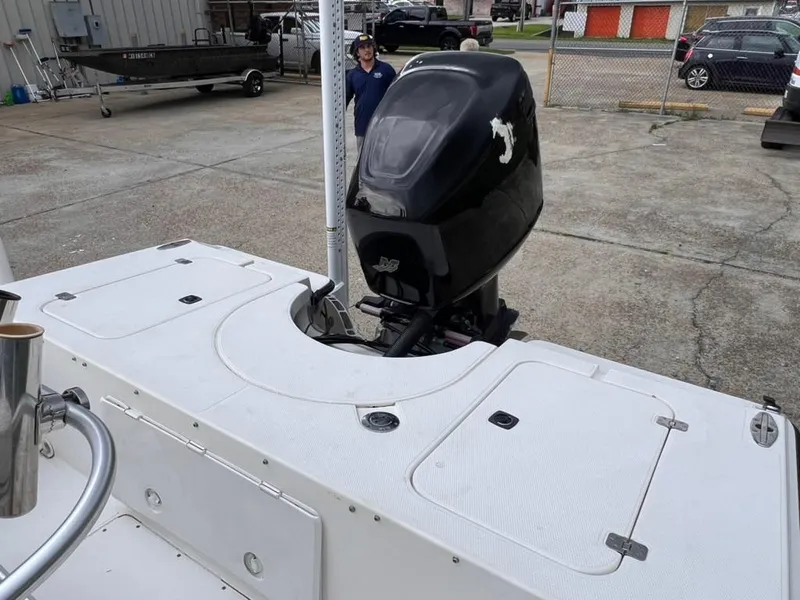 Slide: The Image of 2001 Rinalli 2100 Bay boat with outboard motor in a marina. - 7