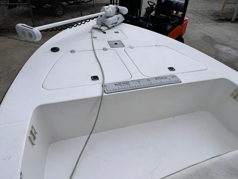 Slide: The Image of 2001 Rinalli 2100 Bay boat deck with storage compartments and trolling motor. - 9