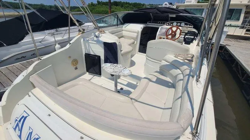 Slide: The Image of 1996 Doral 300 SC boat with spacious seating and elegant interior design. - 12